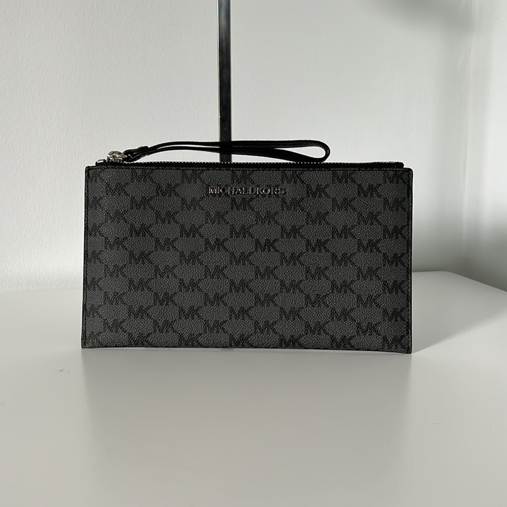 Michael Kors wristlet with silver hardware